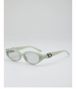 Detail view of mint green sunglasses with hexagonal silver stud and crystal inlay