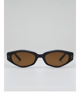 Close-up of polygon sunglasses featuring thick black frames and silver metal stud details