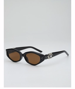 Detail of black frame sunglasses showing silver metal floral hinge and crystal inlay