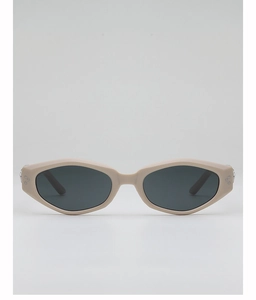 Detail of cream cat-eye sunglasses with matte frame and decorative silver metal rivets