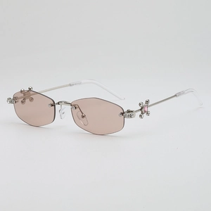 Lunettes de soleil hexagonales sans monture avec branches en métal et gemme rose