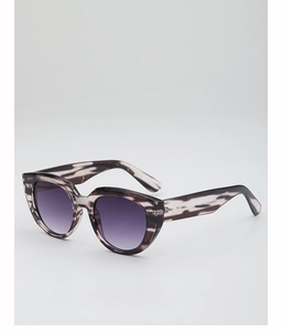Detail of fashion cat-eye sunglasses with purple gradient lenses and marble stripes