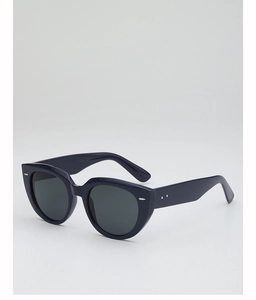 Close-up of navy blue cat-eye sunglasses featuring silver metal accents and grey lenses