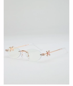 Detail of rose gold oval rimless glasses with diamond-encrusted floral hinge and pink gem