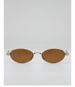 Detail of oval frameless sunglasses with gold celestial orbit temple and crystals