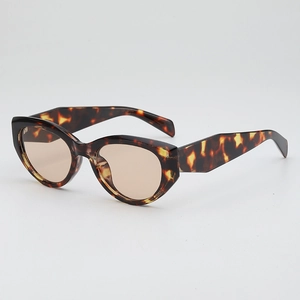 Retro tortoise shell cat-eye sunglasses with translucent brown lenses in a 45-degree view