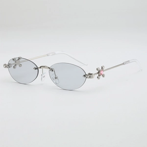 Silver oval rimless sunglasses with gray lenses and rhinestone cross accents