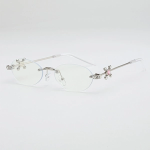 Y2K oval rimless sunglasses with silver metal cross and pink rhinestone detail