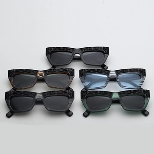 Detail showing carved texture frames and model 3055 specifications on cat-eye sunglasses