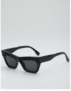 Detail of black cat-eye sunglasses featuring textured crocodile scale pattern on the frame