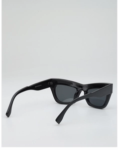 Detail view of black chunky cat-eye frame sunglasses with inner temple size markings