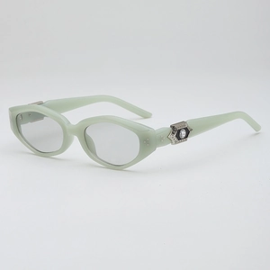 Retro mint green polygonal cat eye sunglasses with silver studs and rhinestone accents