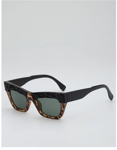 Detail of vintage cat-eye sunglasses with wood-grain texture and tortoiseshell lower frame