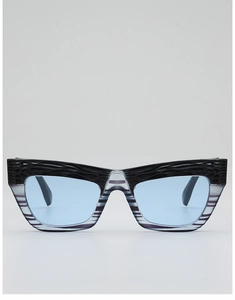 Front detail of cat-eye sunglasses featuring light blue lenses and textured frame
