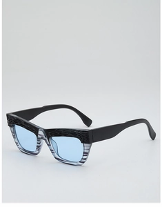 Detail of cat-eye sunglasses featuring unique grey striped frame and blue tinted lenses