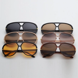 Six pairs of double-bridge aviator sunglasses with gold accents in various lens colors