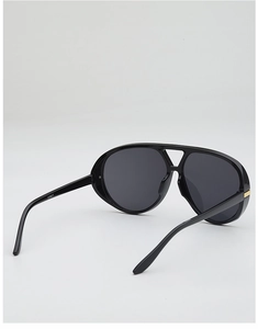 Close-up of black aviator sunglasses with double bridge and CX5517 temple detail