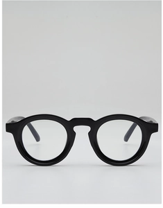 Macro detail of classic black round glasses frame with high-gloss finish and metal hinge