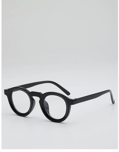 Detail view of glossy black round eyeglass frames with retro minimalist design