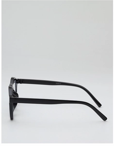 Side view of black round eyeglass frames with ergonomic temples and CX20SS model text