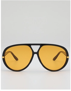 Detail showing retro aviator sunglasses with black frame and yellow lenses with gold accent