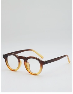 Detail of retro round glasses frame featuring brown to amber gradient finish