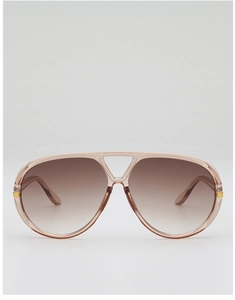 Close-up of translucent pink aviator sunglasses with double bridge and gradient brown lenses