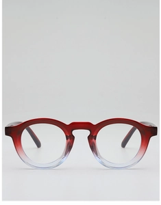 Close-up of retro round glasses frames with a red to transparent gradient finish