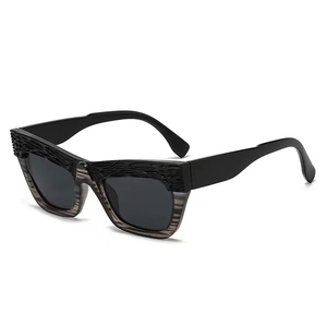 Retro cat-eye sunglasses with black textured frames and grey lenses for outdoor wear