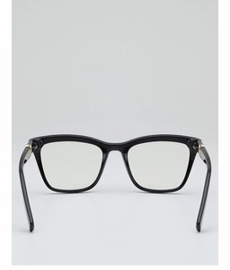 Detail view of square black glasses frame with premium gold metal hinges and clear lenses