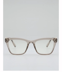 Detail of square eyeglass frames in translucent taupe with golden metal hinge accents