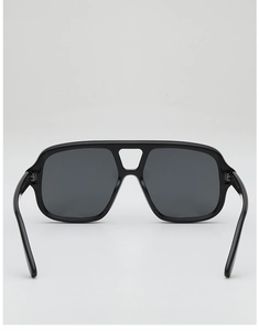 Detail of classic black oversized aviator sunglasses with thick frames and UV lenses