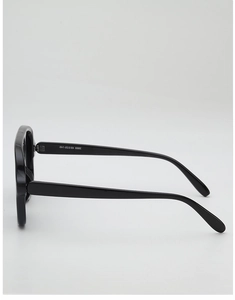 Side view of black oversized sunglasses showing smooth temples and technical specifications