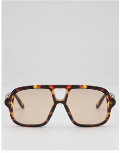 Close-up of tortoiseshell aviator sunglasses with dual-bridge and light brown lenses