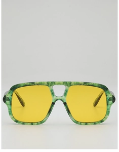 Detail of pilot sunglasses with green marble frame and yellow lenses with double nose bridge