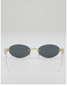 Macro shot of oval rimless sunglasses with dark grey lenses and diamond-studded gold hinges