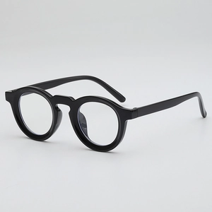 Classic round frame glasses in glossy black finish with minimalist retro aesthetic design