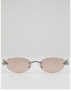 Detail of oval rimless sunglasses with pink lenses and sparkling rhinestone metal accents
