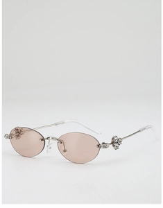 Detail of vintage rimless oval sunglasses with crystal accents and silver metal temples