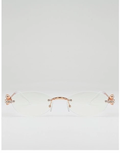 Detail of rimless oval sunglasses with rose gold metal bridge and rhinestone accents