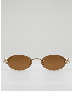 Detail of crystal-encrusted hinges on oval rimless sunglasses with gold metal frame