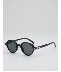 Detail of vintage round sunglasses in black with silver metal arrow accents on temples
