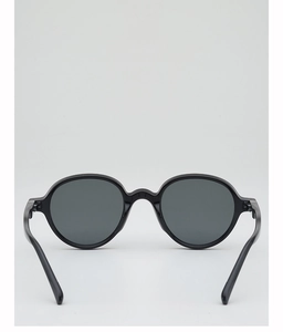 Detail of vintage round black sunglasses with smooth frames and integrated nose pads