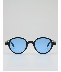 Detail of round black vintage sunglasses featuring light blue lenses and silver arrow hinges
