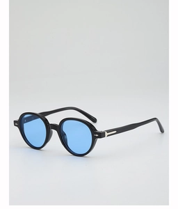 Detail view of round black sunglasses with blue lenses and silver diamond-shaped metal accents