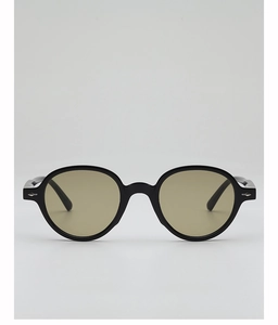 Detail of round black sunglasses frame with vintage silver arrow rivets and tinted lenses