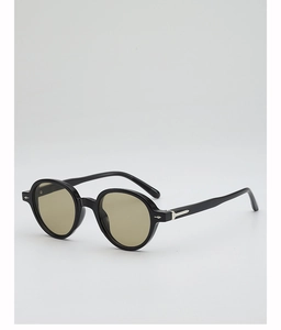 Detail of retro round black sunglasses featuring silver metal arrow hinge accents