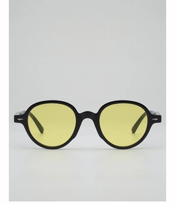 Detail of round black frame sunglasses with yellow lenses and silver arrow metal rivets