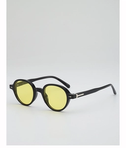 Detail of retro round black sunglasses with yellow lenses and silver arrow rivets