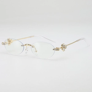 Oval rimless sunglasses with gold metal temples and diamond-studded floral accents